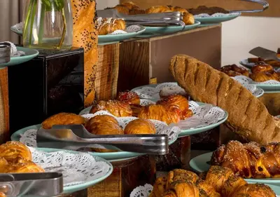 a display of plates of pastries and breads at Luxor Or Aswan Nile Cruise, Ultra Deluxe Cruises sailing 3, 4, Or 7 Nights in Luxor