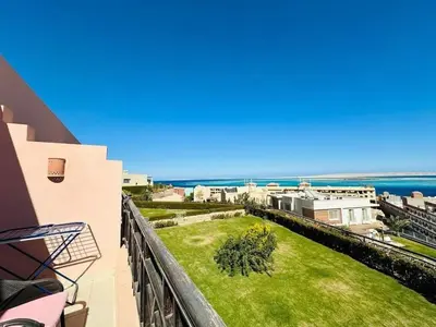 a balcony with a view of the ocean at Doplex for rent in the view 18 in Hurghada