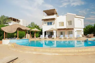 a large swimming pool in front of a villa at 6 Bedroom Villa in El-Gouna 38 in Hurghada