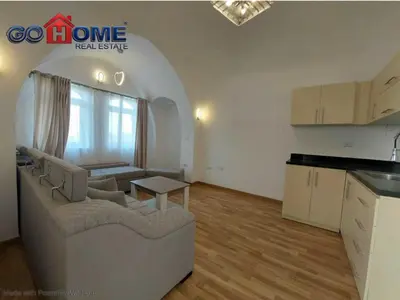 a living room with a couch and a table in a kitchen at 2 Bedroom In Kafr El-Gouna in Hurghada