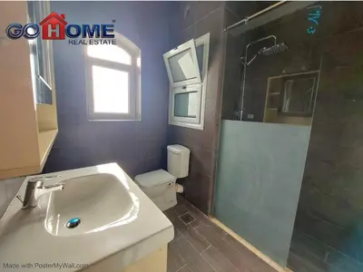a bathroom with a sink and a shower and a toilet at 2 Bedroom In Kafr El-Gouna in Hurghada