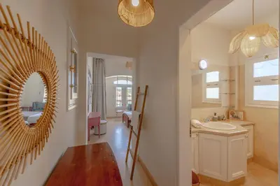 a bathroom with a mirror and a sink at Dream Beach House on Island 3BR Priv Pool Sabina El Gouna in Hurghada