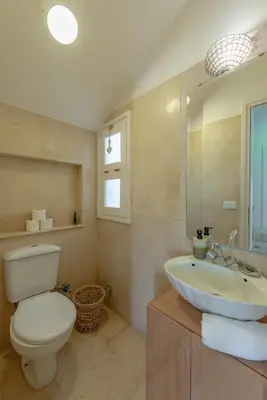a bathroom with a white toilet and a sink at Dream Beach House on Island 3BR Priv Pool Sabina El Gouna in Hurghada