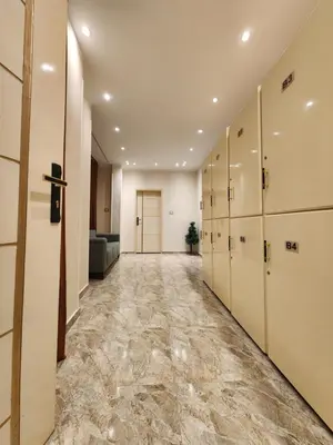 an empty hallway with lockers and a row of lockers at Hana Stay Hostel in Luxor