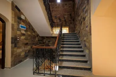 a staircase in a building with a brick wall at Nile View House in Aswan