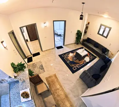 an overhead view of a living room with a couch at Dreams By Mon in Al Karnak