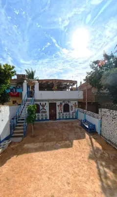 a building with a mural on the side of it at Dreams By Mon in Al Karnak