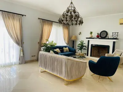 a living room with a couch and a fireplace at Luxury villa in gouna in Hurghada