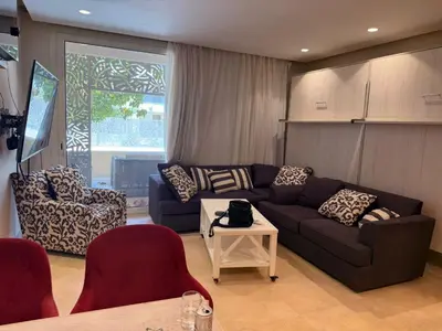 a living room with a couch and a table at 1 Bedroom In Mangroovy M1 -7B -011 in Hurghada