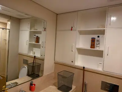a bathroom with white cabinets and a sink at 1 Bedroom In Mangroovy M1 -7B -011 in Hurghada