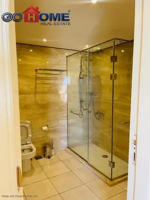 a bathroom with a shower and a toilet at Studio In Marina El Gouna in Hurghada