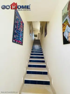 a stairway with blue and white stairs in a building at Studio In Marina El Gouna in Hurghada