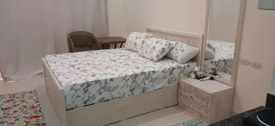 a bedroom with a bed with a mirror at Florenza Khamsin Hurghada in Hurghada