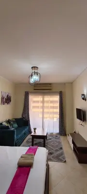 a living room with a bed and a couch at Florenza in Hurghada