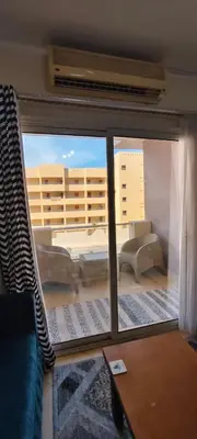 a view of a living room with a window at Florenza in Hurghada