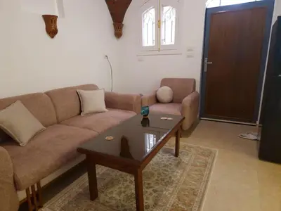 a living room with a couch and a coffee table at Mountain house in ‘Ezbet Abu Ḥabashi