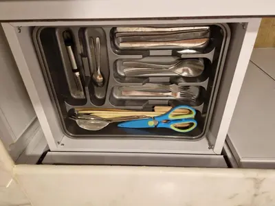 a drawer with scissors and other utensils in it at Mountain house in ‘Ezbet Abu Ḥabashi