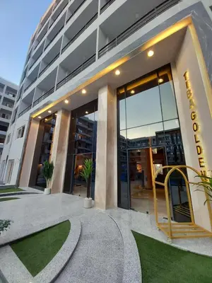 a building with a sign on the front of it at Luxury studio with beach in Hurghada