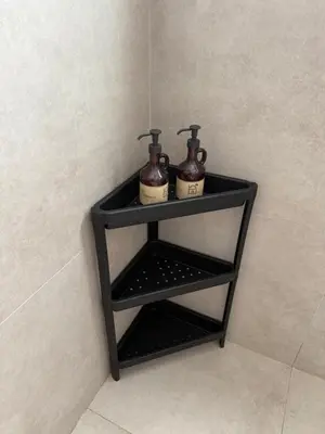 a shelf in a bathroom with two bottles on it at Fanadir Marina Vista in Hurghada