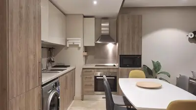 a kitchen with a table and a dining room at Stylish Gouna Mangroovy Retreat in Hurghada