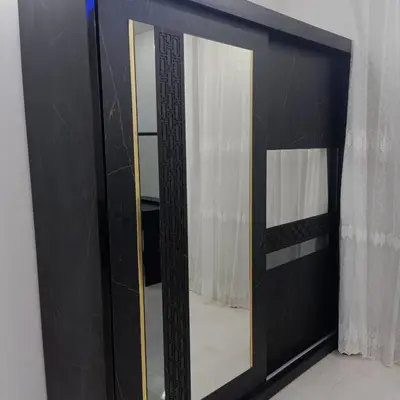 a mirror with a black frame in a room at Selena bay resort in Hurghada