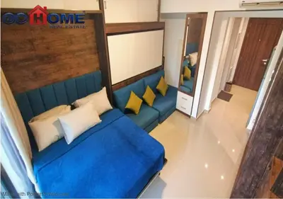 a blue couch with yellow pillows in a room at Cozy Studio 1BR G Cribs b19-g7 El-Gouna Shared Heatd Pool in El Gouna