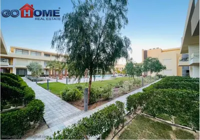 a park in a building with a tree and bushes at Cozy Studio 1BR G Cribs b19-g7 El-Gouna Shared Heatd Pool in El Gouna