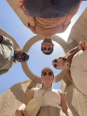 a group of people standing in a circle at Cataract Nile View Rooms in Shellal