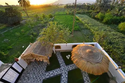 an aerial view of a house with an umbrella at Villa Luna Simone in Al Karnak