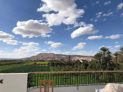 a balcony with a view of the mountains at Villa Luna Simone in Al Karnak