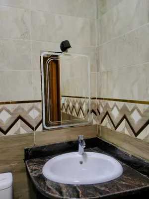 a bathroom with a sink and a mirror at Hurghada European style in Hurghada