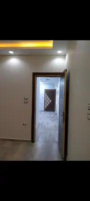an empty room with a door and a hallway at Hurghada European style in Hurghada