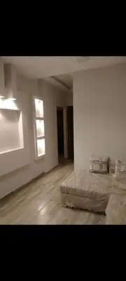 an empty room with two beds and a window at Hurghada European style in Hurghada