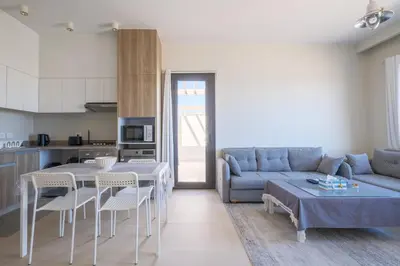 a living room with a couch and a table at Brand New Shedwan Spacious 1Bdr in Hurghada