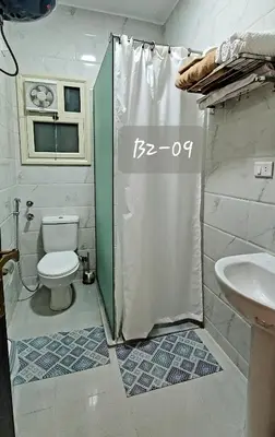 a bathroom with a shower with a toilet and a sink at Seaview 2 Bedroom Private Deluxe Condo at Juliana Beach Resort B2-09 in Hurghada