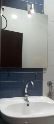 a bathroom with a white sink and a mirror at Casablanca Resort A F in Hurghada