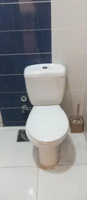 a white toilet in a bathroom with a shower at Casablanca Resort A F in Hurghada