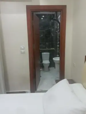 a view of a bathroom with a toilet and a mirror at شقه على النيل in Luxor