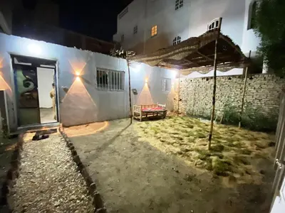 a courtyard of a house at night at Ammar Guest House in Luxor