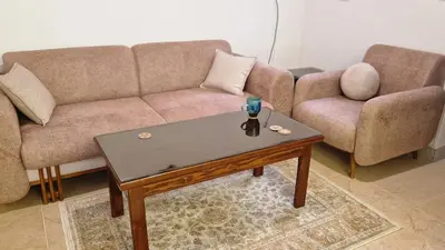 a living room with a couch and a coffee table at House Mountain Luxor - Villa for rent in Luxor