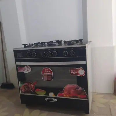 a stove is sitting in the corner of a room at Old Nile Retreat in Luxor