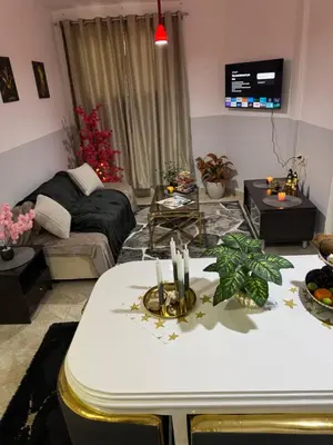 a living room with a table with candles on it at Modernes Komfort mit Smart TV & Power W-LAN, Strandnähe in Hurghada in Hurghada
