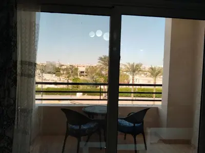 a view of a table and chairs from a window at Andalus in in Hurghada