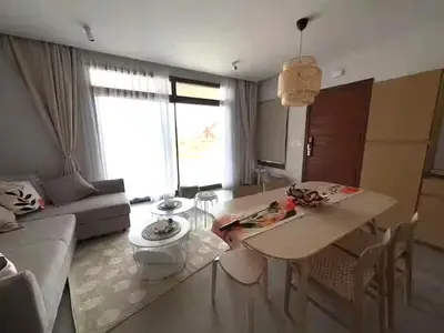 a living room with a table and a couch at Somabay-Mesca - Relaxing Ground Floor in Hurghada