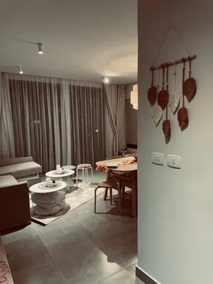 a living room with a couch and a table at Somabay-Mesca - Relaxing Ground Floor in Hurghada
