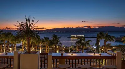 a view of the ocean at sunset from a resort at Somabay-Mesca - Relaxing Ground Floor in Hurghada