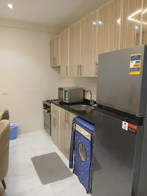 a kitchen with a refrigerator and a sink at Adler-Hurghada Holiday apartment sea view rooftop pool 80m to beach in Hurghada