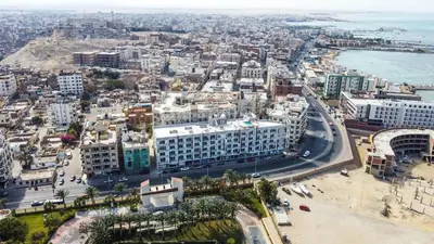 an aerial view of a city with the ocean at Adler-Hurghada Holiday apartment sea view rooftop pool 80m to beach in Hurghada