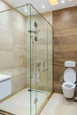 a shower stall in a bathroom with a toilet at Elaskary in Hurghada