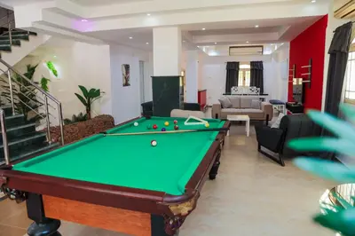 a pool table in a living room with a bill at Elaskary in Hurghada